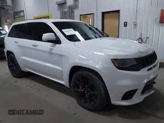 2018 Jeep Grand Cherokee SRT z VIN 1C4RJFDJXJC154046, wystawiony jako IAAI lot #42062169 z przebiegiem 64 953 mil mil oraz . Historia ofert i sprzedaży dostępna na DreamBid. Obrazek 1.