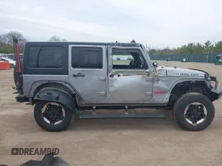 2015 Jeep Wrangler Unlimited Rubicon with VIN 1C4BJWFG1FL546018, listed as a IAAI auction lot 42060045 with 107,249 mi miles and . Bid and sale history available at DreamBid. Image 14.