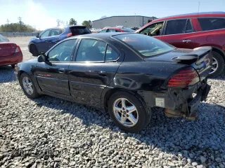 2001 Pontiac Grand Am GT with VIN 1G2NW52E71C201750, listed as a Copart auction lot 43238965 with 179,284 mi miles and Salvage Title. Bid and sale history available at carsss.com. Image 2.