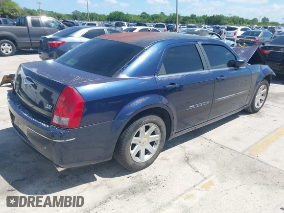 2005 Chrysler 300 with VIN 2C3JA53G25H167944, listed as a IAAI auction lot 41963114 with 196,635 mi miles. Bid and sale history available at carsss.com. Image 4.