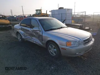 2004 Kia Optima LX z VIN KNAGD126045302372, wystawiony jako IAAI lot #41022315 z przebiegiem 199 588 mil mil oraz . Historia ofert i sprzedaży dostępna na DreamBid. Obrazek 1.