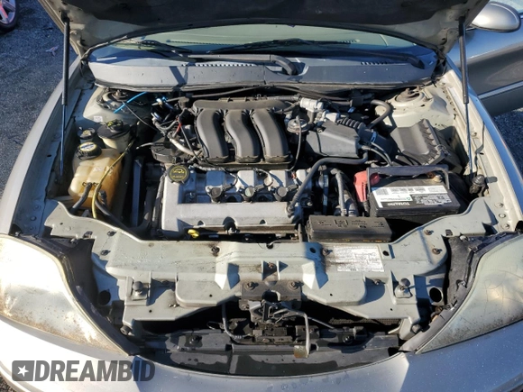 2004 Mercury Sable LS Premium with VIN 1MEHM55S84A614002, listed as a Copart auction lot 56582965 with 185,589 mi miles and Salvage title. Bid and sale history available at DreamBid. Image 11.