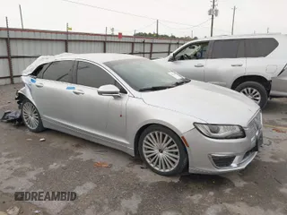 2017 Lincoln MKZ Reserve z VIN 3LN6L5E97HR607705, wystawiony jako IAAI lot #41827162 z przebiegiem 77 852 mil mil oraz . Historia ofert i sprzedaży dostępna na DreamBid. Obrazek 1.