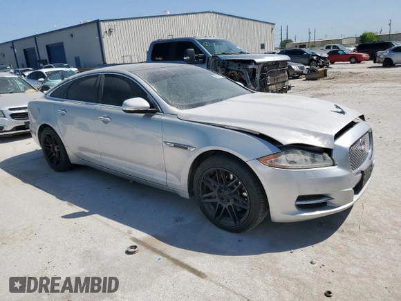 2012 Jaguar XJ with VIN SAJWA1CB0CLV23002, listed as a Copart auction lot 52804915 with 149,331 mi miles and Salvage title. Bid and sale history available at DreamBid. Image 4.