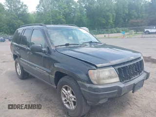 2003 Jeep Grand Cherokee Laredo with VIN 1J4GW48S03C557756, listed as a IAAI auction lot 42507884 with 195,236 mi miles and . Bid and sale history available at DreamBid. Image 1.