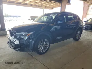 2019 Mazda CX-5 Grand Touring with VIN JM3KFADM3K1539890, listed as a Copart auction lot 57809835 with 56,079 mi miles and Salvage title. Bid and sale history available at DreamBid. Image 1.