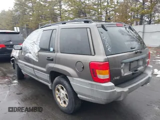 2000 Jeep Grand Cherokee Laredo with VIN 1J4GW48S1YC170303, listed as a IAAI auction lot 41582257 with 191,062 mi miles and . Bid and sale history available at DreamBid. Image 3.