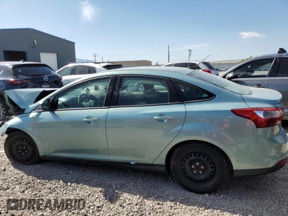 2012 Ford Focus SE with VIN 1FAHP3F24CL163896, listed as a Copart auction lot 61651015 with Not provided miles and Salvage title. Bid and sale history available at DreamBid. Image 2.