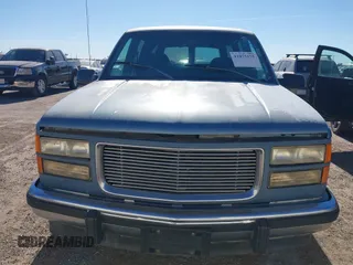 1994 GMC Suburban with VIN 1GKEC16K2RJ721119, listed as a IAAI auction lot 41075175 with 344,904 mi miles. Bid and sale history available at carsss.com. Image 6.