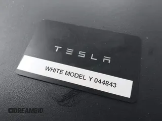 2020 Tesla Model Y Long Range with VIN 5YJYGDEE4LF044843, listed as a IAAI auction lot 41799504 with 40,770 mi miles and . Bid and sale history available at DreamBid. Image 11.