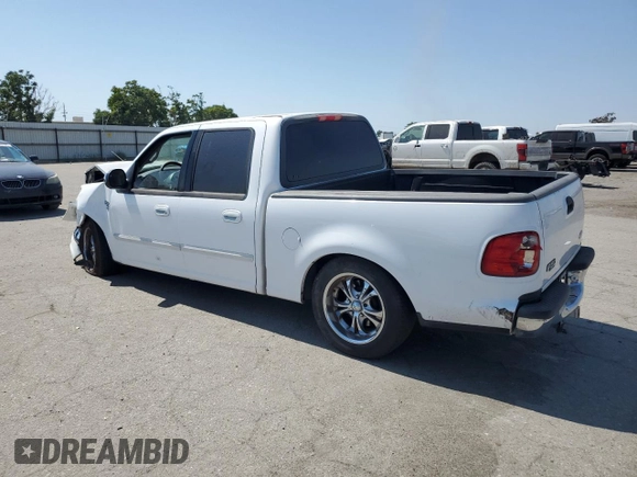 2001 Ford F-150 XLT with VIN 1FTRW07651KC49772, listed as a Copart auction lot 59904815 with 145,639 mi miles and Salvage title. Bid and sale history available at DreamBid. Image 2.