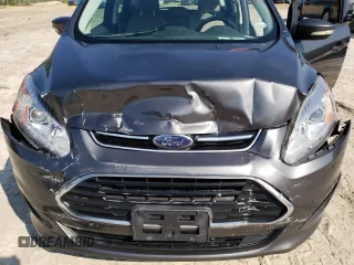 2017 Ford C-Max Energi SE with VIN 1FADP5EUXHL108664, listed as a Copart auction lot 63443913 with 104,634 mi miles. Bid and sale history available at carsss.com. Image 12.