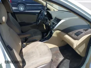 2014 Hyundai Accent GLS with VIN KMHCT4AE1EU590386, listed as a IAAI auction lot 42155202 with 248,545 mi miles. Bid and sale history available at carsss.com. Image 5.