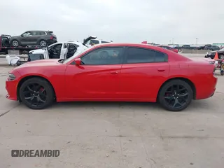 2015 Dodge Charger SXT z VIN 2C3CDXHG1FH901897, wystawiony jako IAAI lot #41795453 z przebiegiem 186 686 mil mil oraz . Historia ofert i sprzedaży dostępna na DreamBid. Obrazek 14.