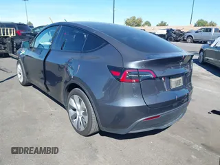 2023 Tesla Model Y Long Range with VIN 7SAYGAEE8PF976969, listed as a IAAI auction lot 41877784 with 25,896 mi miles. Bid and sale history available at carsss.com. Image 15.