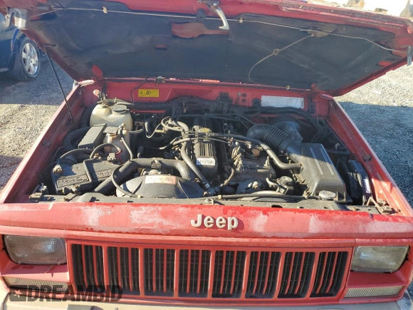 1993 Jeep Cherokee z VIN 1J4FT78S9PL634409, wystawiony jako Copart lot #77034984 z przebiegiem 146 585 mil mil oraz Szkoda całkowita • Salvage title. Historia ofert i sprzedaży dostępna na DreamBid. Obrazek 11.