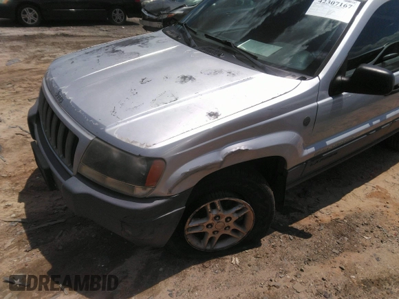 2004 Jeep Grand Cherokee Laredo z VIN 1J4GW48SX4C309998, wystawiony jako IAAI lot #42307167 z przebiegiem 306 912 mil mil oraz . Historia ofert i sprzedaży dostępna na DreamBid. Obrazek 6.
