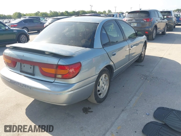 2002 Saturn SL z VIN 1G8ZK54702Z130021, wystawiony jako IAAI lot #42091064 z przebiegiem 68 754 mil mil oraz . Historia ofert i sprzedaży dostępna na DreamBid. Obrazek 4.