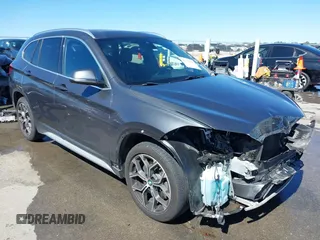 2020 BMW X1 sDrive28i with VIN WBXJG7C0XL3L92799, listed as a IAAI auction lot 41752133 with 92,328 mi miles. Bid and sale history available at carsss.com. Image 1.