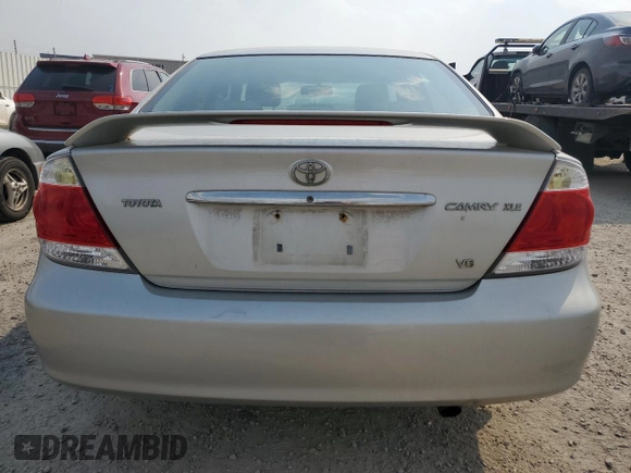 2006 Toyota Camry LE z VIN 4T1BF30K66U115872, wystawiony jako Copart lot #60526695 z przebiegiem 164 561 mil mil oraz Szkoda całkowita • Salvage title. Historia ofert i sprzedaży dostępna na DreamBid. Obrazek 6.
