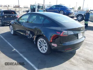 2022 Tesla Model 3 Long Range with VIN 5YJ3E1EB1NF133356, listed as a IAAI auction lot 41568303 with 73,406 mi miles and . Bid and sale history available at DreamBid. Image 3.