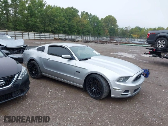 2013 Ford Mustang GT with VIN 1ZVBP8CF7D5281965, listed as a IAAI auction lot 40408688 with 121,477 mi miles. Bid and sale history available at carsss.com. Image 1.