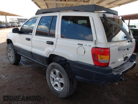 2000 Jeep Grand Cherokee Laredo z VIN 1J4GW48S4YC299149, wystawiony jako IAAI lot #42347792 z przebiegiem 229 007 mil mil oraz . Historia ofert i sprzedaży dostępna na DreamBid. Obrazek 3.