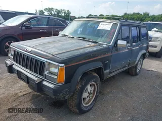 1991 Jeep Cherokee z VIN 1J4FJ58S6ML572036, wystawiony jako IAAI lot #42659999 z przebiegiem 200 845 mil mil oraz . Historia ofert i sprzedaży dostępna na DreamBid. Obrazek 2.