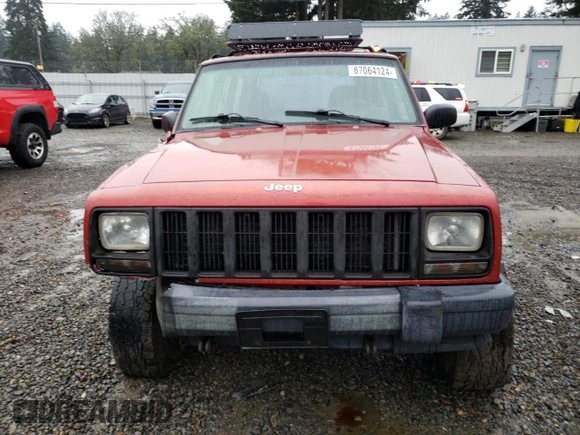 1999 Jeep Cherokee SE with VIN 1J4FF28S9XL645291, listed as a Copart auction lot 87064124 with Not provided miles and Salvage title. Bid and sale history available at DreamBid. Image 5.