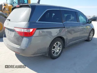 2012 Honda Odyssey EX-L with VIN 5FNRL5H69CB128585, listed as a IAAI auction lot 41695109 with 231,565 mi miles and . Bid and sale history available at carsss.com. Image 4.