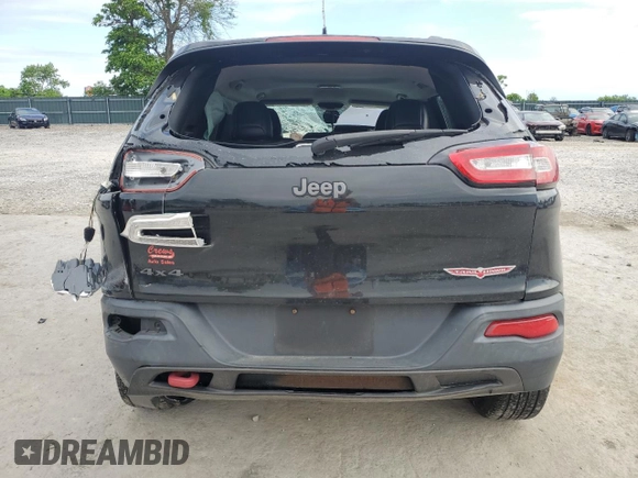 2014 Jeep Cherokee Trailhawk with VIN 1C4PJMBB2EW173458, listed as a Copart auction lot 56146355 with Not provided miles and Salvage title. Bid and sale history available at DreamBid. Image 6.