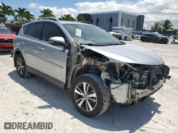 2018 Toyota RAV4 XLE with VIN 2T3WFREV7JW423768, listed as a Copart auction lot 61841875 with 111,991 mi miles and Salvage title. Bid and sale history available at DreamBid. Image 4.