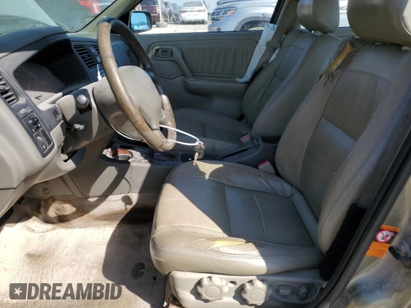 2000 Infiniti G20 Luxury z VIN JNKCP11A5YT311938, wystawiony jako Copart lot #48509185 z przebiegiem 186 595 mil mil oraz Szkoda całkowita • Salvage title. Historia ofert i sprzedaży dostępna na DreamBid. Obrazek 7.