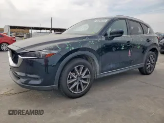 2018 Mazda CX-5 Grand Touring z VIN JM3KFADM9J1338395, wystawiony jako Copart lot #53396255 z przebiegiem 107 877 mil mil oraz Czysty tytuł • Clean title. Historia ofert i sprzedaży dostępna na DreamBid. Obrazek 1.