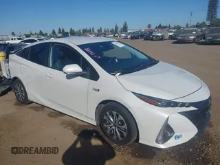 2021 Toyota Prius LE z VIN JTDKAMFP7M3173830, wystawiony jako IAAI lot #42236240 z przebiegiem 87 983 mil mil oraz . Historia ofert i sprzedaży dostępna na DreamBid. Obrazek 1.