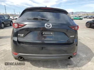 2018 Mazda CX-5 Touring z VIN JM3KFBCM4J0444167, wystawiony jako Copart lot #45900645 z przebiegiem 85 881 mil mil oraz Czysty tytuł • Clean title. Historia ofert i sprzedaży dostępna na DreamBid. Obrazek 6.