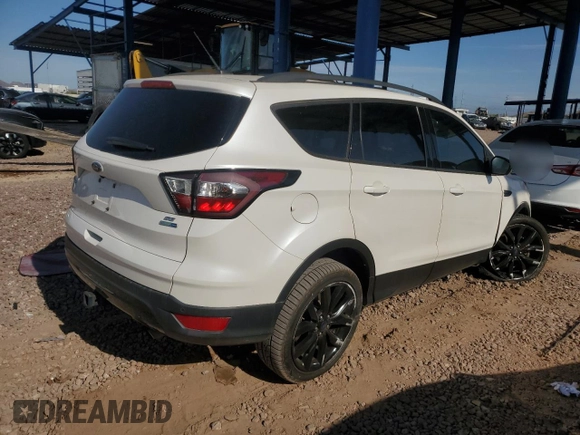 2017 Ford Escape SE z VIN 1FMCU9G97HUC26806, wystawiony jako Copart lot #65464674 z przebiegiem 93 023 mil mil oraz Szkoda całkowita • Salvage title. Historia ofert i sprzedaży dostępna na DreamBid. Obrazek 3.