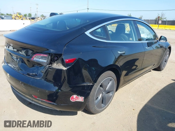 2018 Tesla Model 3 Long Range Battery with VIN 5YJ3E1EA7JF057031, listed as a IAAI auction lot 42139832 with 92,618 mi miles and . Bid and sale history available at DreamBid. Image 4.