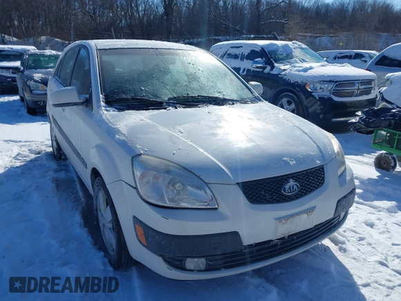 2009 Kia Rio LX with VIN KNADE243196500999, listed as a IAAI auction lot 41582717 with 119,877 mi miles. Bid and sale history available at carsss.com. Image 1.