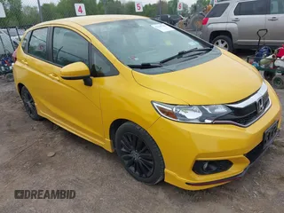2018 Honda Fit Sport z VIN 3HGGK5H6XJM711509, wystawiony jako IAAI lot #42245769 z przebiegiem 115 806 mil mil oraz . Historia ofert i sprzedaży dostępna na DreamBid. Obrazek 1.