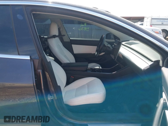 2019 Tesla Model 3 Mid Range with VIN 5YJ3E1EA5KF327679, listed as a IAAI auction lot 41804379 with 87,208 mi miles and . Bid and sale history available at DreamBid. Image 5.