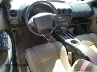 1997 Pontiac Firebird Trans Am z VIN 2G2FV22P5V2209729, wystawiony jako Copart lot #78074474 z przebiegiem 84 727 mil mil oraz Czysty tytuł • Clean title. Historia ofert i sprzedaży dostępna na DreamBid. Obrazek 8.