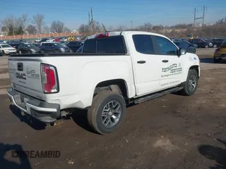 2021 GMC Canyon 4WD AT4 w/Leather with VIN 1GTG6FEN0M1279289, listed as a IAAI auction lot 41620801 with 134,699 mi miles. Bid and sale history available at carsss.com. Image 4.