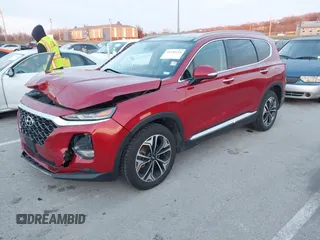 2019 Hyundai Santa Fe Ultimate with VIN 5NMS5CAA4KH105145, listed as a IAAI auction lot 41156214 with 54,796 mi miles and . Bid and sale history available at DreamBid. Image 18.
