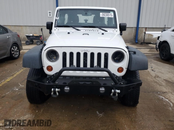 2013 Jeep Wrangler Unlimited Sport z VIN 1C4BJWDG0DL574795, wystawiony jako Copart lot #59230515 z przebiegiem 132 808 mil mil oraz Szkoda całkowita • Salvage title. Historia ofert i sprzedaży dostępna na DreamBid. Obrazek 5.