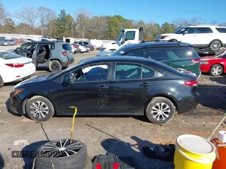 2022 Toyota Corolla Hybrid LE with VIN JTDEAMDE2NJ039206, listed as a IAAI auction lot 41592129 with 97,593 mi miles. Bid and sale history available at carsss.com. Image 14.