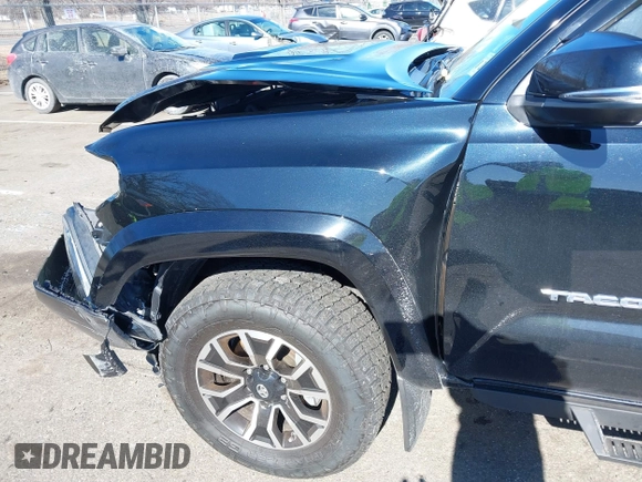 2021 Toyota Tacoma 4WD SR5 with VIN 3TMDZ5BN4MM117564, listed as a IAAI auction lot 41629220 with 77,063 mi miles. Bid and sale history available at carsss.com. Image 6.