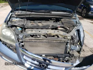 2006 Honda Odyssey Touring z VIN 5FNRL388X6B009356, wystawiony jako Copart lot #55991335 z przebiegiem 101 816 mil mil oraz Szkoda całkowita • Salvage title. Historia ofert i sprzedaży dostępna na DreamBid. Obrazek 11.