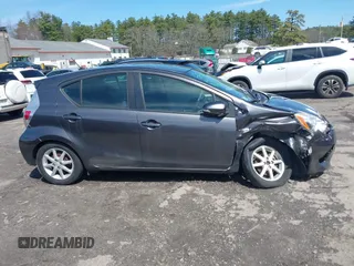 2014 Toyota Prius One z VIN JTDKDTB32E1070932, wystawiony jako IAAI lot #41950966 z przebiegiem 93 952 mil mil oraz . Historia ofert i sprzedaży dostępna na DreamBid. Obrazek 13.