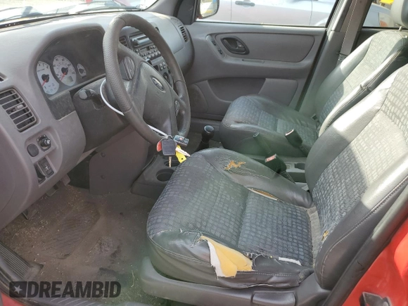 2002 Ford Escape XLS Value with VIN 1FMYU01B82KC15443, listed as a Copart auction lot 77998164 with 212,313 mi miles and Salvage title. Bid and sale history available at DreamBid. Image 7.